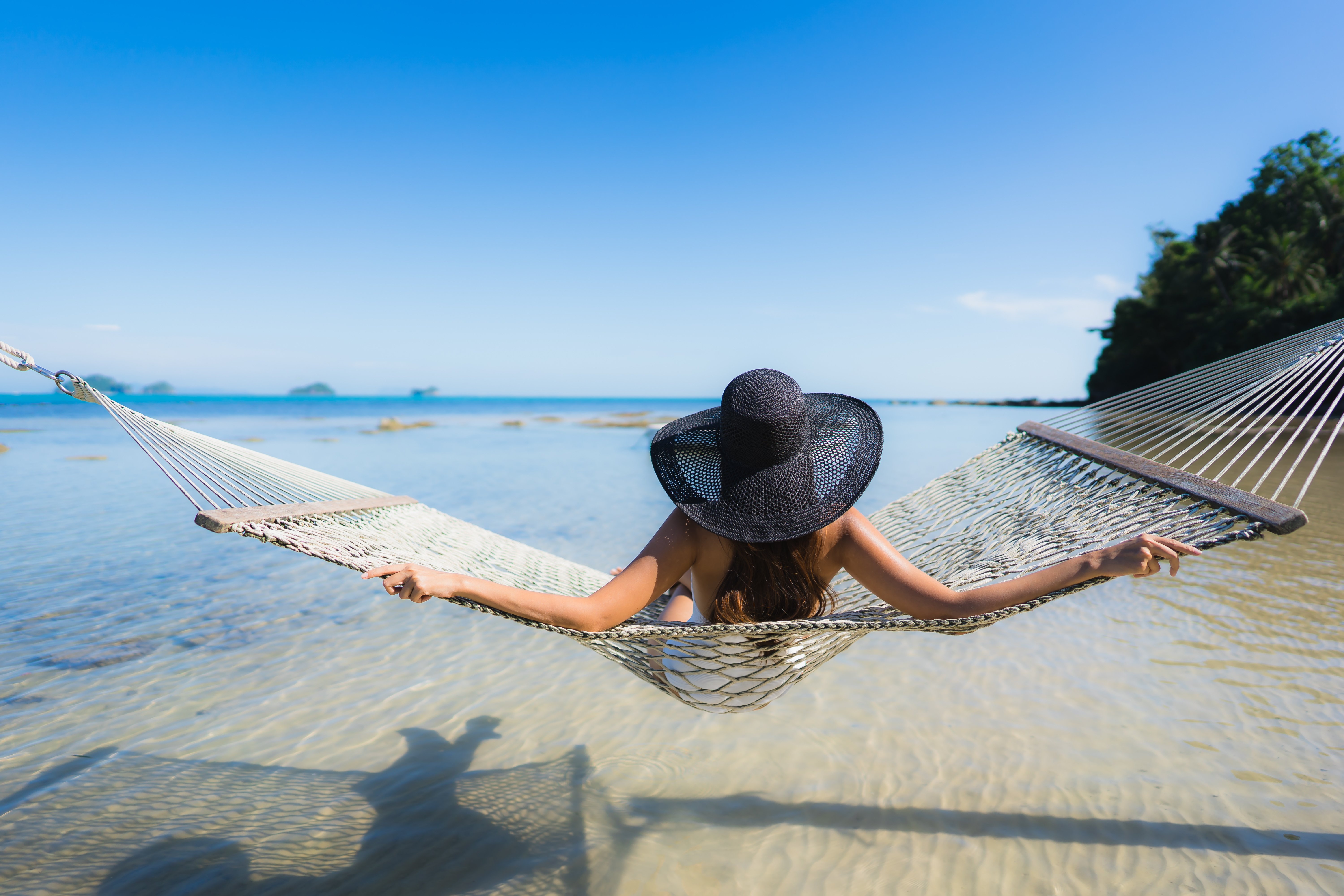 portrait-beautiful-young-asian-woman-sitting-hammock-around-sea-beach-ocean-relax